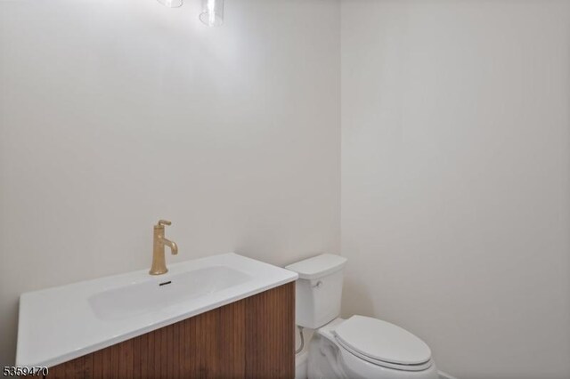 1 Willow Pl, East Hanover Twp, NJ 07936 - half bath featuring toilet, baseboards, and vanity