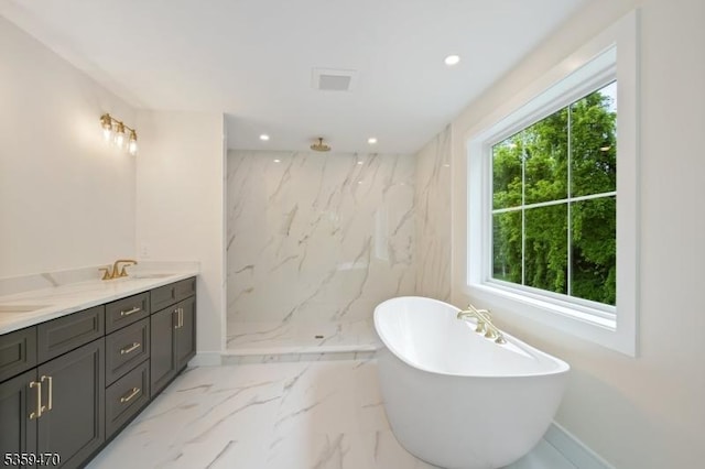 1 Willow Pl, East Hanover Twp, NJ 07936 - bathroom with marble tiled floors, a soaking tub, a marble finish shower, recessed lighting, and baseboards