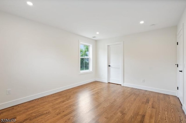 1 Willow Pl, East Hanover Twp, NJ 07936 - spare room with wood finished floors, baseboards, and recessed lighting