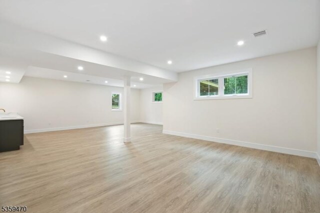 1 Willow Pl, East Hanover Twp, NJ 07936 - basement with light wood finished floors, recessed lighting, and baseboards