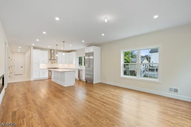 1 Willow Pl, East Hanover Twp, NJ 07936 - unfurnished living room with light wood-style flooring, baseboards, and recessed lighting