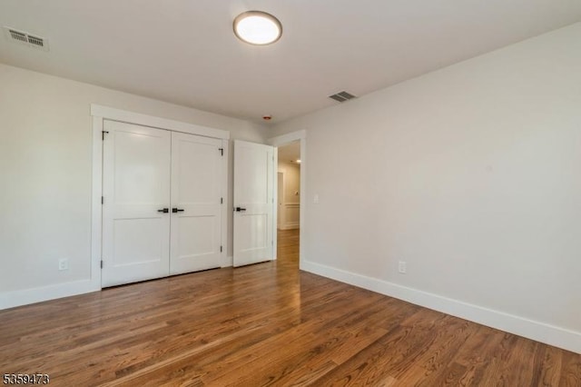 32 N Ave, Fanwood Boro, NJ 07023 - unfurnished bedroom with baseboards, wood finished floors, and a closet