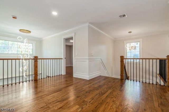32 N Ave, Fanwood Boro, NJ 07023 - spare room featuring wood finished floors, plenty of natural light, a chandelier, crown molding, and a wainscoted wall