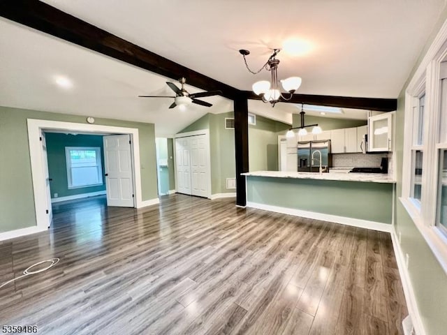 90 Georgia Ave, Jefferson Twp, NJ 07849 - unfurnished living room featuring ceiling fan, a chandelier, dark wood-type flooring, and baseboards