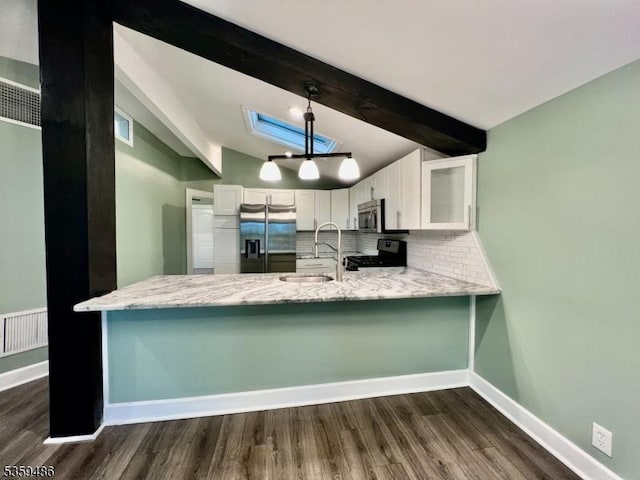 90 Georgia Ave, Jefferson Twp, NJ 07849 - kitchen featuring stainless steel appliances, decorative backsplash, dark wood-style floors, and white cabinetry