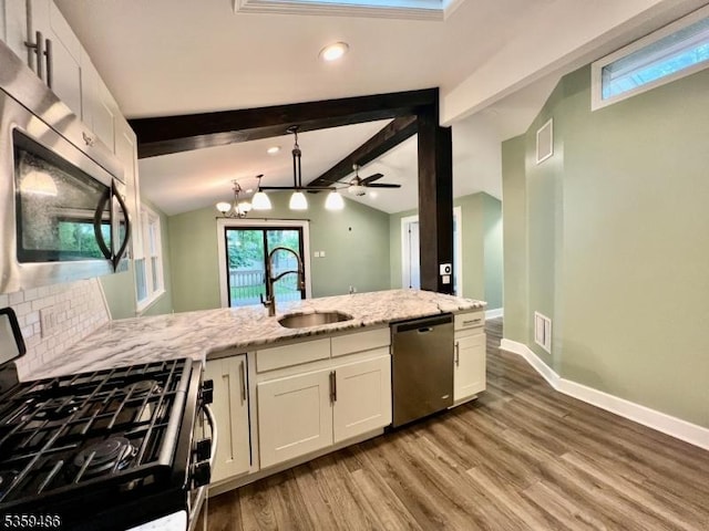 90 Georgia Ave, Jefferson Twp, NJ 07849 - kitchen with appliances with stainless steel finishes, a sink, white cabinetry, light wood finished floors, and light stone countertops