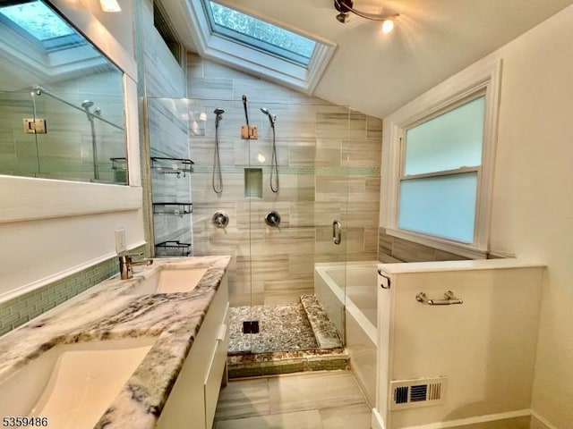 90 Georgia Ave, Jefferson Twp, NJ 07849 - full bathroom featuring a skylight, a stall shower, lofted ceiling, double vanity, and a bath