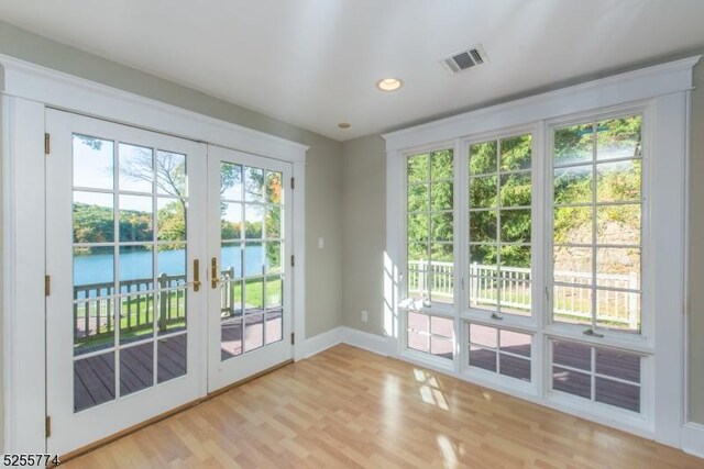 1 Brook Valley Ter, Kinnelon Boro, NJ 07405 - entryway with french doors, a water view, light wood finished floors, baseboards, and recessed lighting
