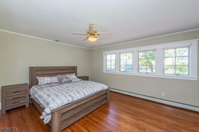 1 Brook Valley Ter, Kinnelon Boro, NJ 07405 - bedroom featuring a baseboard heating unit, wood finished floors, ornamental molding, and a ceiling fan