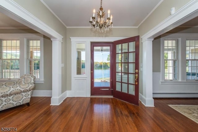 1 Brook Valley Ter, Kinnelon Boro, NJ 07405 - foyer with a baseboard radiator, wood finished floors, a chandelier, baseboards, and decorative columns