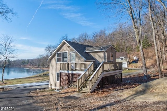 1 Brook Valley Ter, Kinnelon Boro, NJ 07405 - view of front of house with stairway and a deck with water view
