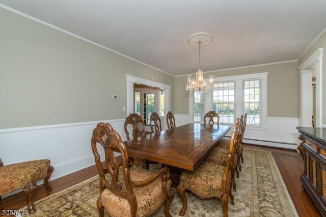 1 Brook Valley Ter, Kinnelon Boro, NJ 07405 - dining room featuring a baseboard heating unit, wood finished floors, a chandelier, crown molding, and french doors