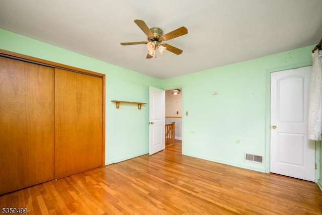 777 W Scott Ave, Rahway City, NJ 07065 - unfurnished bedroom with wood finished floors, a closet, baseboards, and a ceiling fan