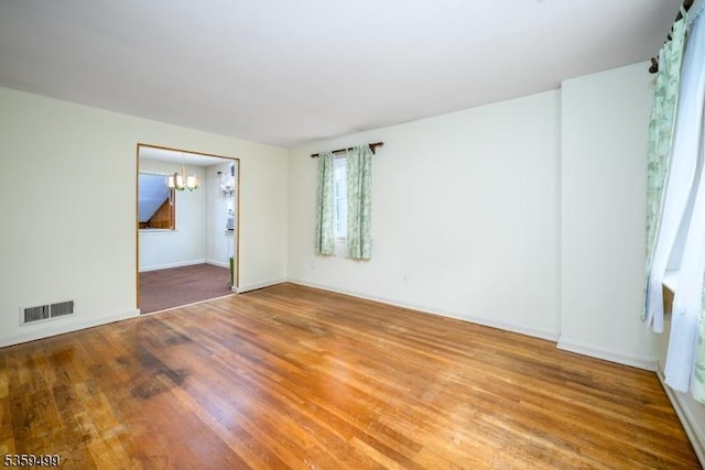 777 W Scott Ave, Rahway City, NJ 07065 - spare room featuring a chandelier, wood finished floors, and baseboards
