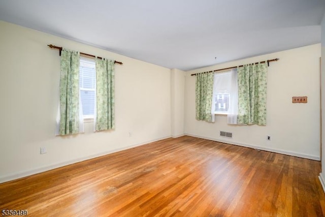 777 W Scott Ave, Rahway City, NJ 07065 - empty room featuring wood finished floors and baseboards