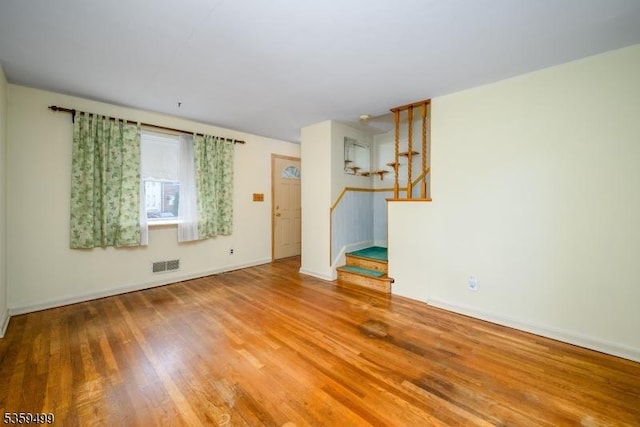777 W Scott Ave, Rahway City, NJ 07065 - empty room featuring stairway, wood finished floors, and baseboards