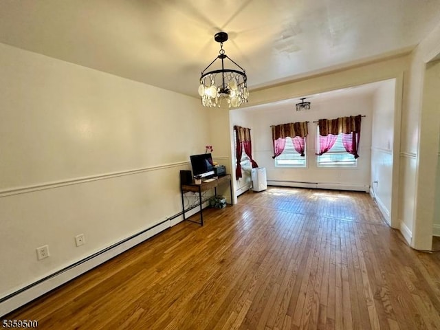 341 S 18th St, Newark City, NJ 07103 - spare room featuring a chandelier, wood-type flooring, baseboard heating, and baseboards