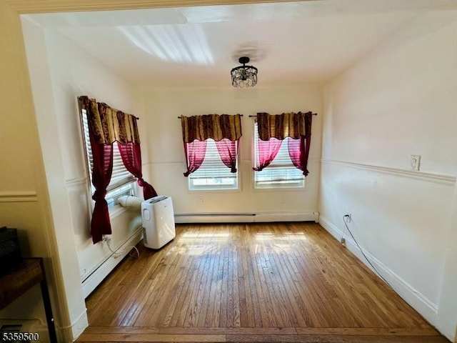 341 S 18th St, Newark City, NJ 07103 - spare room featuring a baseboard heating unit, wood-type flooring, baseboard heating, and baseboards