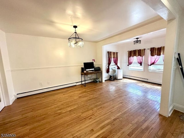 341 S 18th St, Newark City, NJ 07103 - living room featuring a chandelier, hardwood / wood-style floors, a baseboard heating unit, and baseboards
