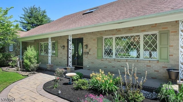 700 Schoolhouse Ln, Bound Brook Boro, NJ 08805 - entrance to property with brick siding, roof with shingles, and a porch