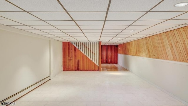 700 Schoolhouse Ln, Bound Brook Boro, NJ 08805 - finished below grade area featuring a baseboard radiator, wood walls, tile patterned floors, a drop ceiling, and baseboards