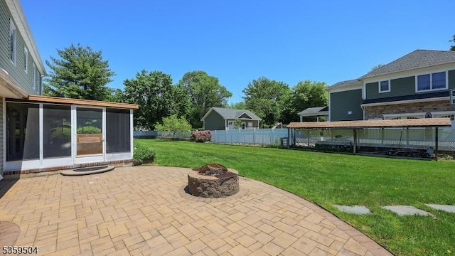 700 Schoolhouse Ln, Bound Brook Boro, NJ 08805 - view of patio / terrace featuring a sunroom and a fire pit