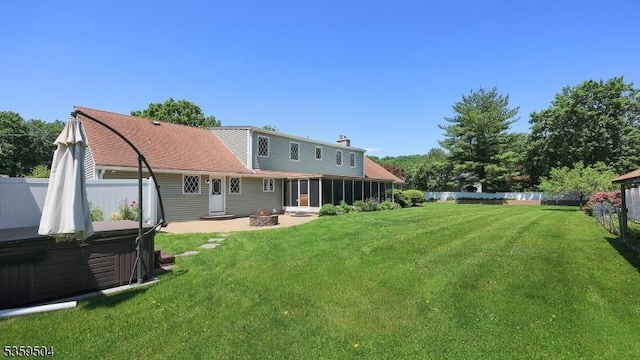700 Schoolhouse Ln, Bound Brook Boro, NJ 08805 - back of house featuring a hot tub, a sunroom, and a chimney