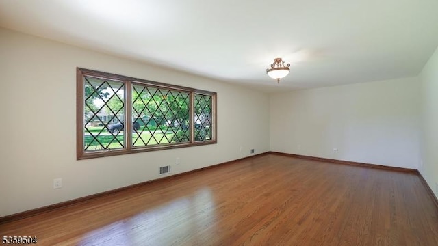 700 Schoolhouse Ln, Bound Brook Boro, NJ 08805 - empty room featuring wood finished floors and baseboards
