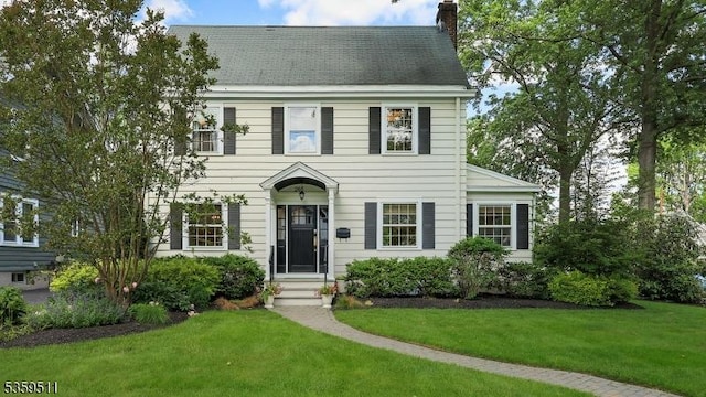 265 S Scotch Plains Ave, Westfield Town, NJ 07090 - colonial house featuring a chimney and a front lawn