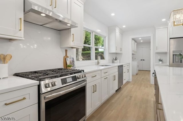 17 Misty Mountain Rd, Randolph Twp, NJ 07869 - kitchen featuring appliances with stainless steel finishes, under cabinet range hood, a sink, white cabinetry, and recessed lighting