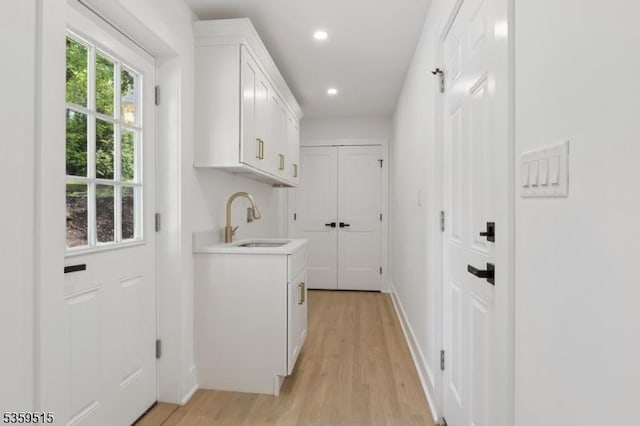 17 Misty Mountain Rd, Randolph Twp, NJ 07869 - laundry room with light wood finished floors, recessed lighting, cabinet space, and baseboards