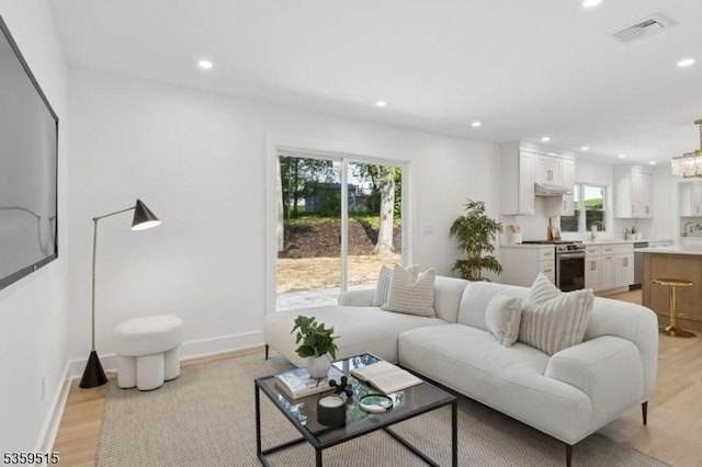 17 Misty Mountain Rd, Randolph Twp, NJ 07869 - living room featuring recessed lighting, healthy amount of natural light, light wood-type flooring, and baseboards