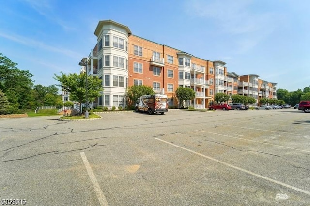 4112 Pointe Gate Dr, Livingston Twp, NJ 07039 - view of apartment building / complex featuring uncovered parking