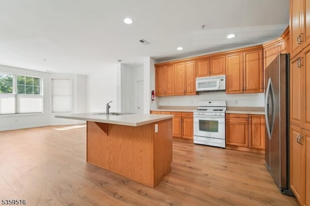 4112 Pointe Gate Dr, Livingston Twp, NJ 07039 - kitchen featuring white appliances, a kitchen island with sink, recessed lighting, light countertops, and light wood-type flooring