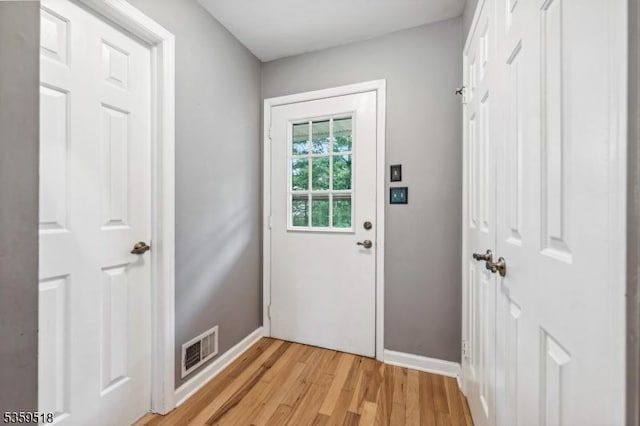 2406 Jamestown Cmn, Hillsborough Twp, NJ 08844 - doorway featuring light wood-type flooring and baseboards
