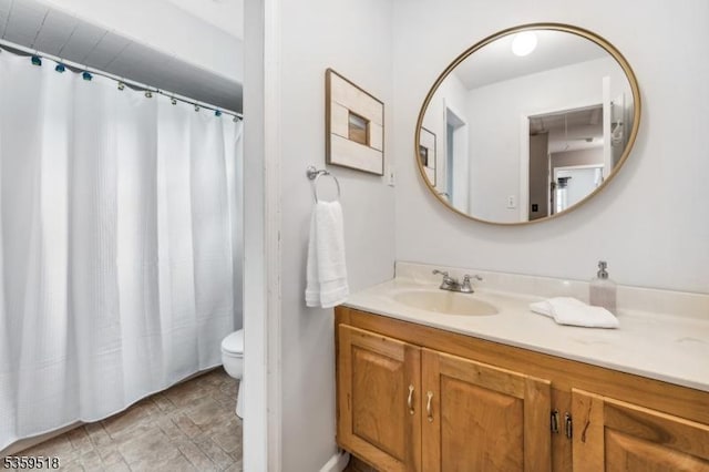 2406 Jamestown Cmn, Hillsborough Twp, NJ 08844 - bathroom featuring vanity, toilet, stone finish floors, and a shower with curtain