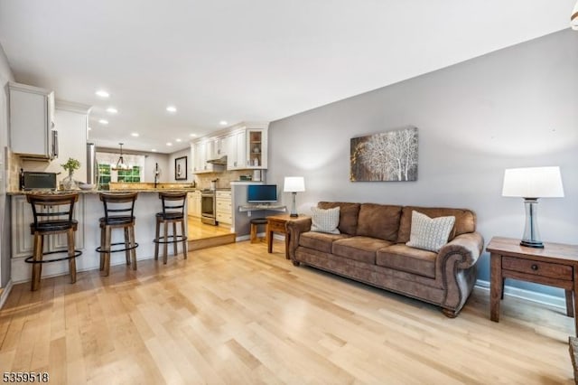 2406 Jamestown Cmn, Hillsborough Twp, NJ 08844 - living room featuring light wood-type flooring and recessed lighting
