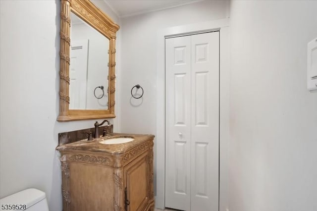 19 Spring St, Ogdensburg Boro, NJ 07439 - half bathroom with a closet, vanity, toilet, and ornamental molding