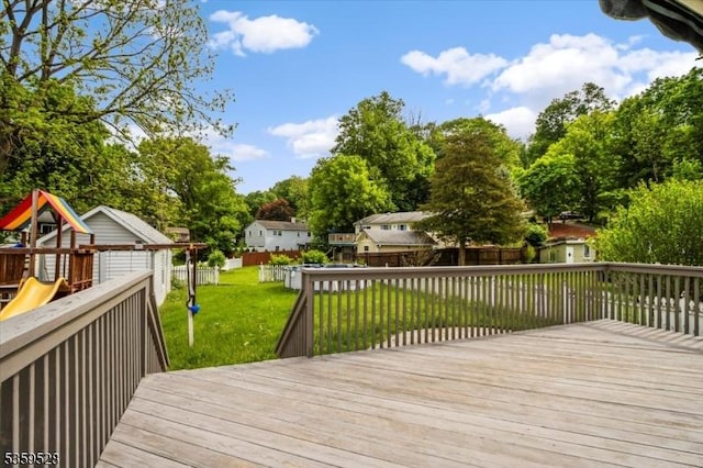 19 Spring St, Ogdensburg Boro, NJ 07439 - wooden deck featuring a playground and view of scattered trees