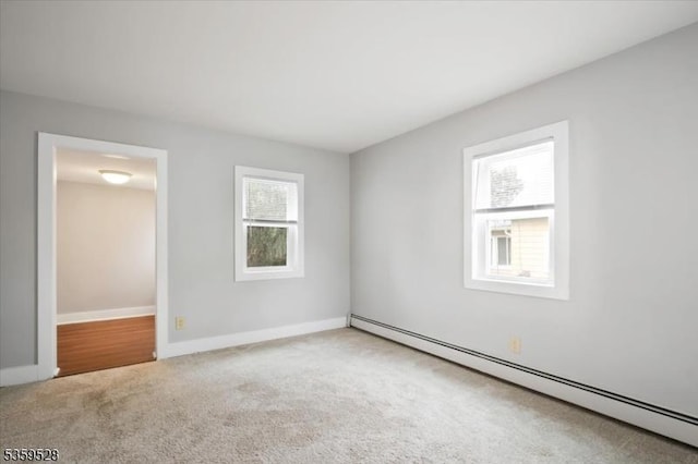 19 Spring St, Ogdensburg Boro, NJ 07439 - carpeted empty room with a baseboard heating unit and baseboards