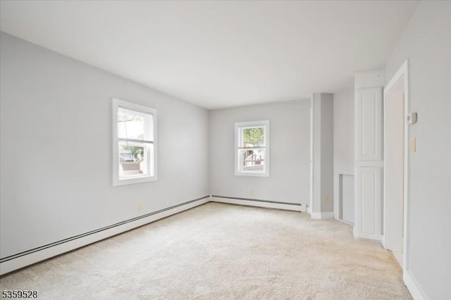 19 Spring St, Ogdensburg Boro, NJ 07439 - empty room featuring light colored carpet, a baseboard heating unit, and baseboards