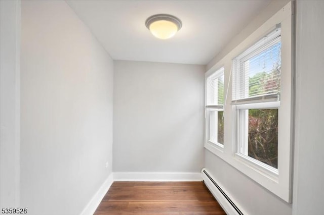 19 Spring St, Ogdensburg Boro, NJ 07439 - unfurnished room featuring wood finished floors, baseboards, and a baseboard heating unit