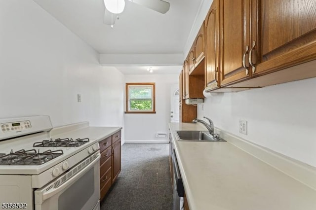 195 Newark Pompton Tpke, Wayne Twp, NJ 07470 - kitchen with white range with gas stovetop, brown cabinets, light countertops, and dark carpet