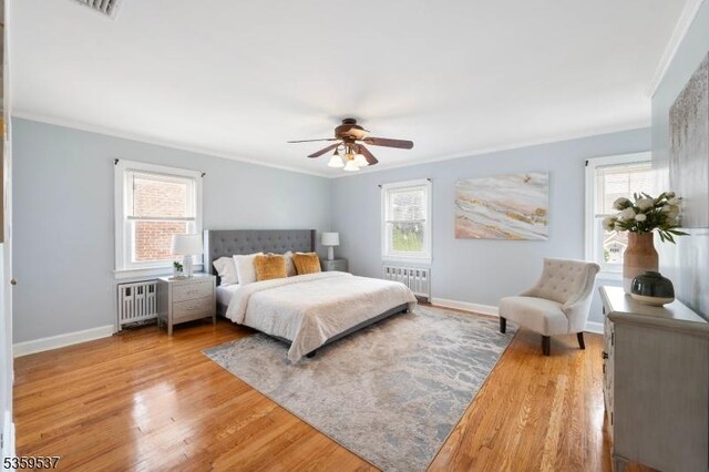 1082 Battle Hill Ter, Union Twp, NJ 07083 - bedroom with radiator heating unit, ornamental molding, multiple windows, and baseboards