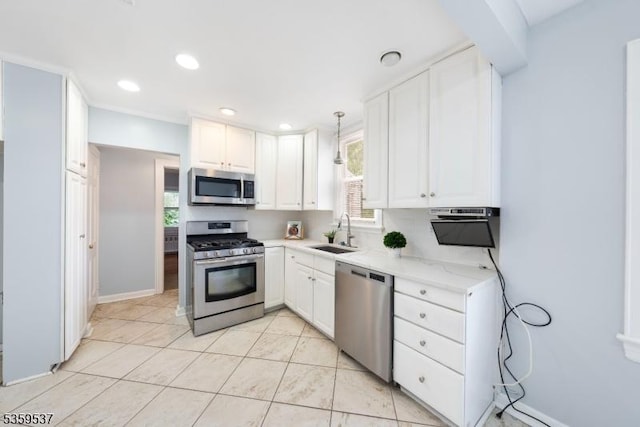1082 Battle Hill Ter, Union Twp, NJ 07083 - kitchen with appliances with stainless steel finishes, a sink, white cabinets, plenty of natural light, and recessed lighting