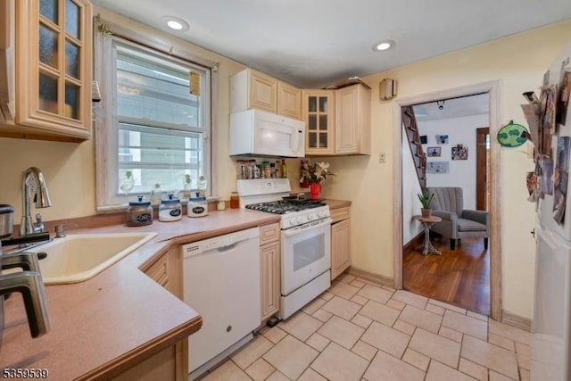 139 Pine Grove Ter, Newark City, NJ 07106 - kitchen with white appliances, a sink, light countertops, glass insert cabinets, and recessed lighting