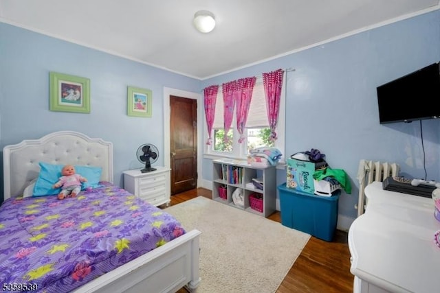 139 Pine Grove Ter, Newark City, NJ 07106 - bedroom featuring radiator, dark wood-type flooring, and ornamental molding