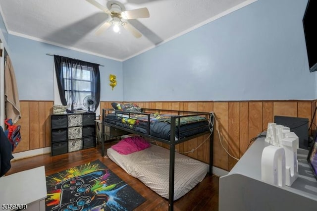 139 Pine Grove Ter, Newark City, NJ 07106 - bedroom featuring wood finished floors, a wainscoted wall, crown molding, wooden walls, and a ceiling fan