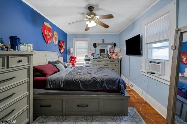 139 Pine Grove Ter, Newark City, NJ 07106 - bedroom featuring multiple windows, crown molding, a ceiling fan, wood finished floors, and baseboards
