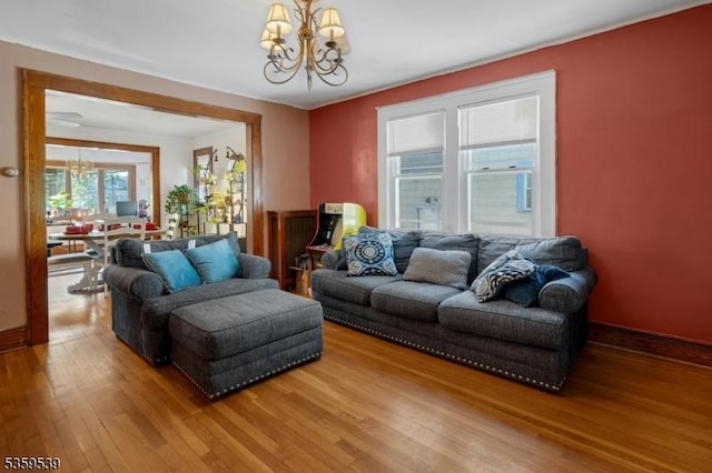 139 Pine Grove Ter, Newark City, NJ 07106 - living room with a chandelier, wood finished floors, and baseboards